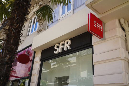 VICHY, FRANCE - JUNE 11, 2026: Exterior facade and red logo sign of SFR telecommunications store on city street