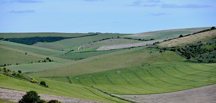 Patchwork Farmland Across Rolling Countryside Hills