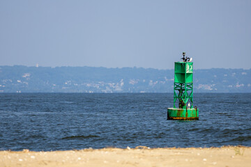 Green Navigation Buoy off Sandy Hook Shoreline © Emily McKenna