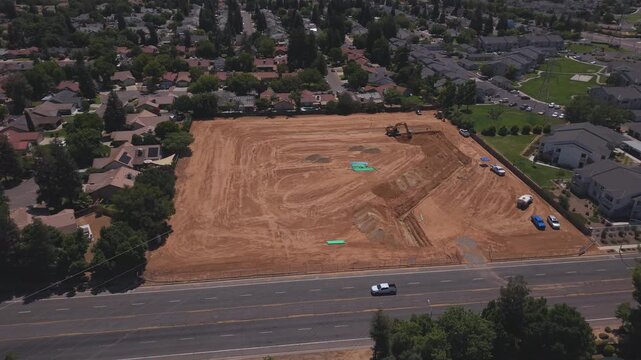 Still Aerial Drone Shot Over Active Construction Site With Workers PVC Pipeline and Heavy Machinery