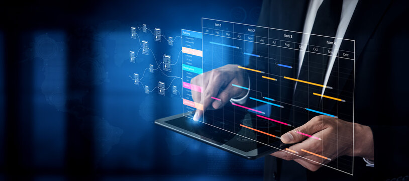 Business professional using digital tablet while interacting with data visualization and project management timeline on an abstract technology background. Bitwise.