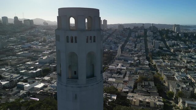 Cinematic drone footage orbiting around Coit Tower on Telegraph Hill in San Francisco. Smooth aerial movement showcasing the iconic Art Deco landmark.