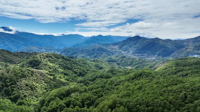 Aerial shot of the low mountains and forest near the small town of Sagada in the Philippines.