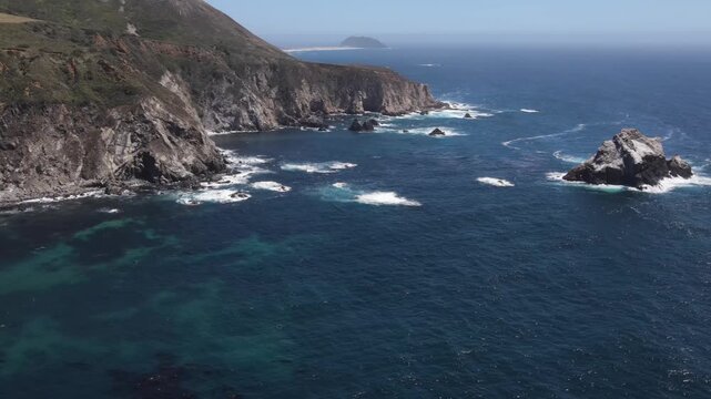 Aerial shot of the rugged coastline along the Pacific Coast Highway in Central California