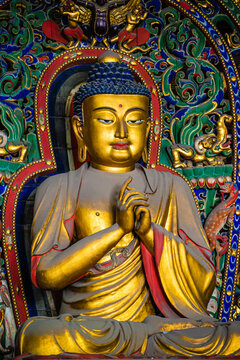 Datong, China - May 9 2026: Ancient Buddhist sculpture in Huayan Temple, expressing spiritual serenity, exquisite craftsmanship, and the legacy of Chinese Buddhist art