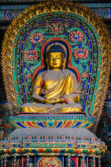 Fototapeta premium Datong, China - May 9 2026: Ancient Buddhist sculpture in Huayan Temple, expressing spiritual serenity, exquisite craftsmanship, and the legacy of Chinese Buddhist art