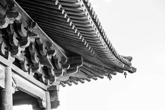 Datong, China - May 9 2026: Intricate roof eaves of Huayan Temple, showcasing elegant Dougong brackets, refined timber craftsmanship, and the timeless beauty of traditional Chinese temple architecture