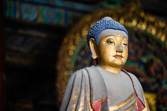 Datong, China - May 9 2026: Ancient Buddhist sculpture in Huayan Temple, expressing spiritual serenity, exquisite craftsmanship, and the legacy of Chinese Buddhist art