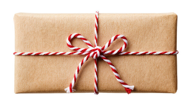 Isolated neatly wrapped parcel in natural kraft paper tied with festive red and white twine bow