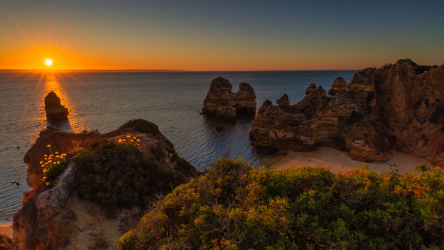 Golden Sunset Over the Cliffs of the Algarve Coast, Portugal
