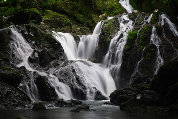 Fototapeta premium Beautiful Multi-Tiered Waterfall Cascading into a Pool in Panama Rainforest