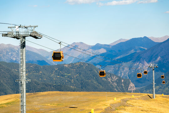 Horizontal cable car lift over mountain resort landscape in Arkhyz Karachay Cherkessia Russia.