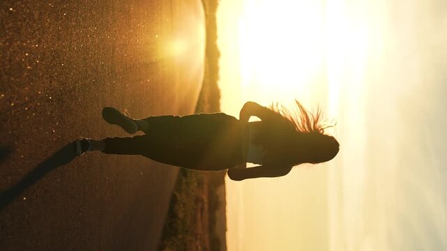 silhouette sports girl running legs along road sunset, smile relaxation, you can run fast, american woman running along road, confident strong, female power, loves run outdoors, sunset health