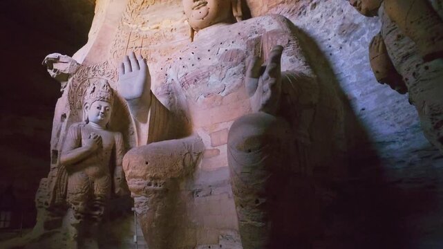 Yungang, China - May 9 2026: Majestic Buddha statue in the Yungang Grottoes, embodying spiritual serenity, monumental artistry, and the rich heritage of ancient Chinese Buddhist culture