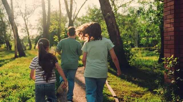 group of children run, running game begins, spring sun shining, boy and girl chase, smiling kids sprint, friends together jogging, recess in nature, energetic schoolchildren running., school recess