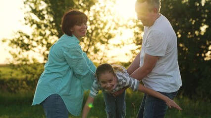 Parents swinging child daughter swing, child kid dreaming airplane pilot, happy girl face sunlight, mother father playing girl sunset, carefree sunshine day, outdoor lifestyle portrait, parents © TO LOVE