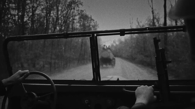 View from a car of a Soviet armored vehicle on a forest road