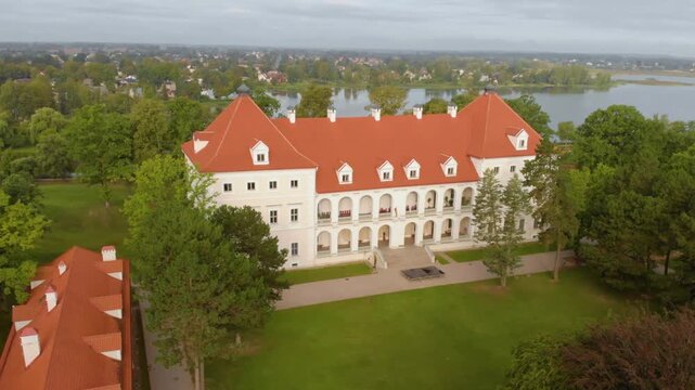 Drone footage capturing the exterior of the 16th century Biržai Castle, a prominent historical fortress and landmark in the town of Biržai, Lithuania.