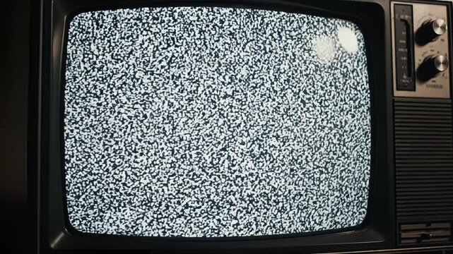 テレビ砂嵐のノイズ画面が広がるレトロなブラウン管背景