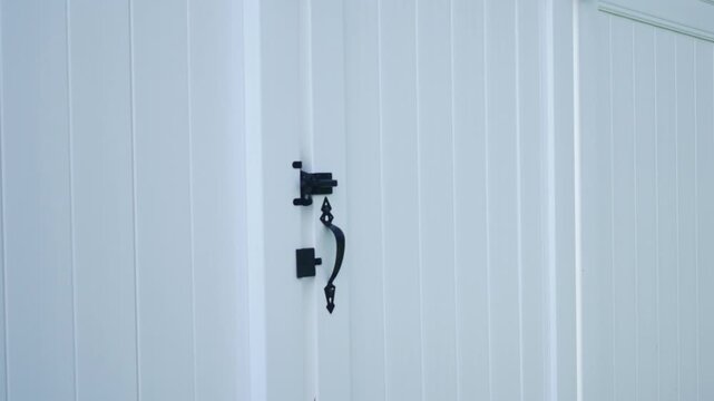 White Fence Gate To a Large Backyard