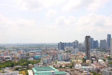 Fototapeta premium High-rise condominiums and urban cityscape around BTS Phra Khanong in Bangkok, Thailand