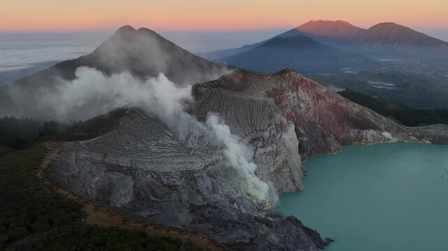 Aerial view of the smoke and fume from Kawah Ijen volcano, East Java of Indonesia. This is an active volcano on the island of Java with an extremely acidic crater lake.