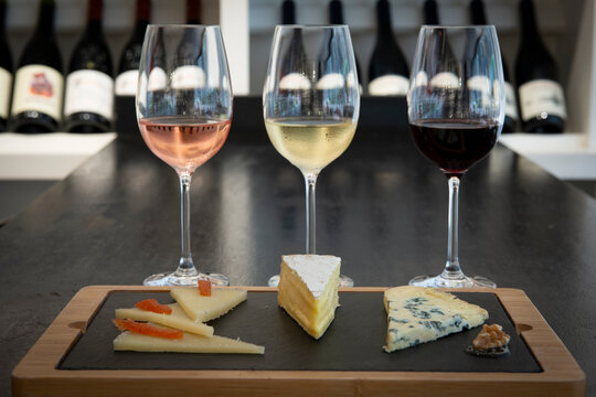 Elegant Cheese and Wine Pairing at a Charming Winery During a Sunny Afternoon