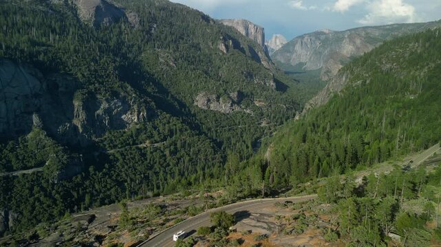 Aerial view of Yosemite Valley showcasing dramatic granite cliffs, lush forests, and winding river under natural daylight in California&rsquo;s Sierra Nevada.