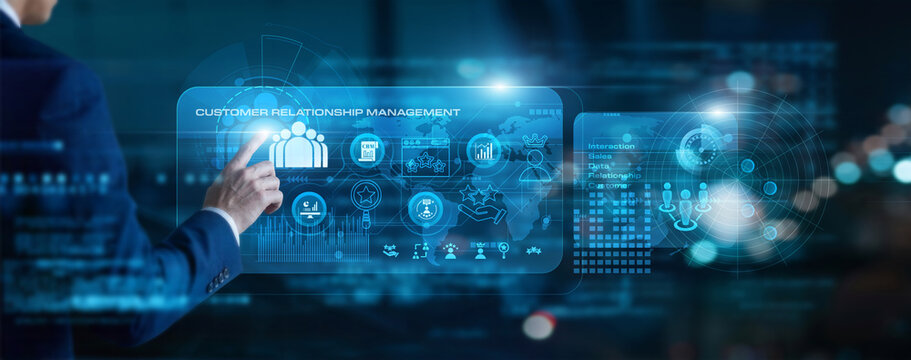 Sales executive touch virtual screen Customer Relationship Management. Tracking leads and client interactions to optimize retention and drive revenue growth through personalized data.