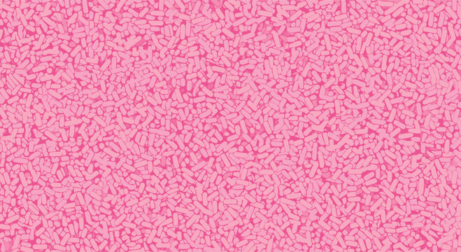 Abstract background filled with a dense texture of small pink and rose colored oblong shapes resembling sprinkles.