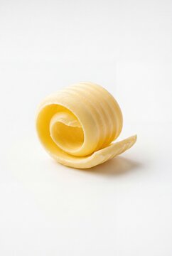 Butter curl isolated on white background dairy food concept