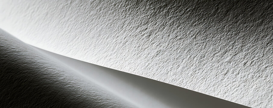 Minimalist black and white textured paper background with elegant curves