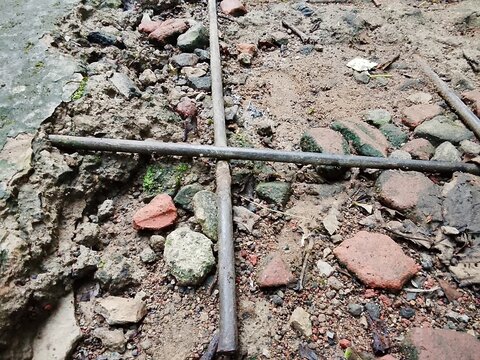 Cracked Concrete with Exposed Steel Rebar Texture
