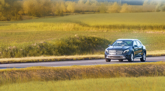 Automobile traveling on a peaceful rural road