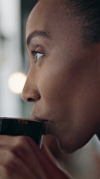 Remote work, woman and thinking with coffee in cafe for reflection, story vision and break. Copywriter, black person and beverage at restaurant window for article inspiration, insight or freelancing