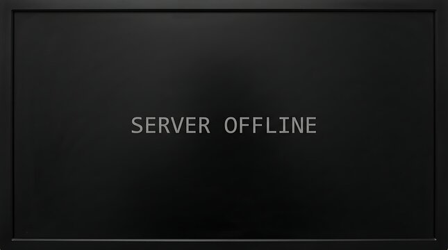 Black computer monitor screen displaying a server offline error message in a dark room.