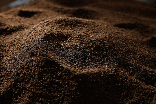 Dark fertile soil texture close-up macro photography for agriculture and gardening background