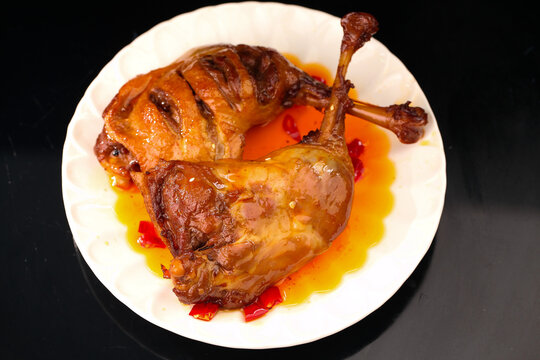 Roasted Duck with Golden Glaze on White Plate - Gourmet Poultry Dish