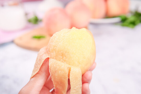 Fresh Yangshan White Peach from Wuxi China - Delicious Peeled Fruit in Hand