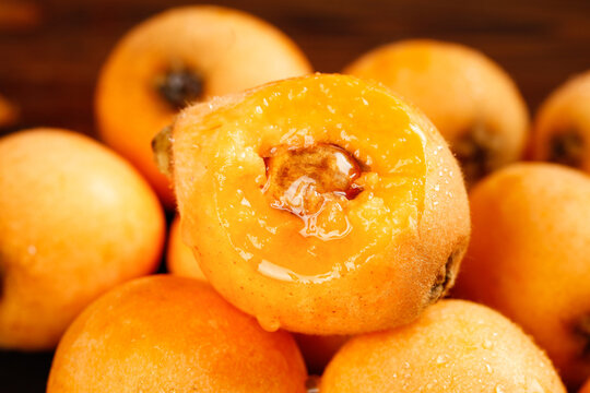 Fresh Loquats from Sichuan Province China Showing Sweet Orange Flesh and Natural Pit Stone Fruit Close-up