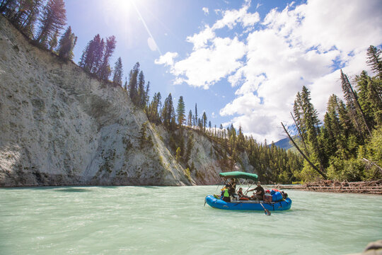 Group floats down a beautiful turquoise glacial river