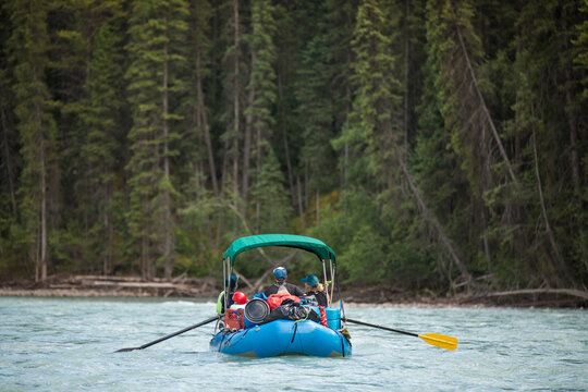 Group of people rafting down a wilderness river