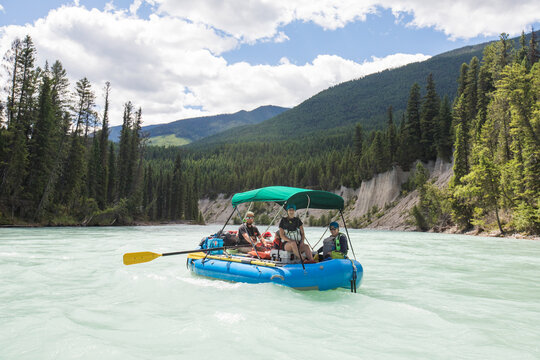 Group of friends on a scenic river rafting adventure