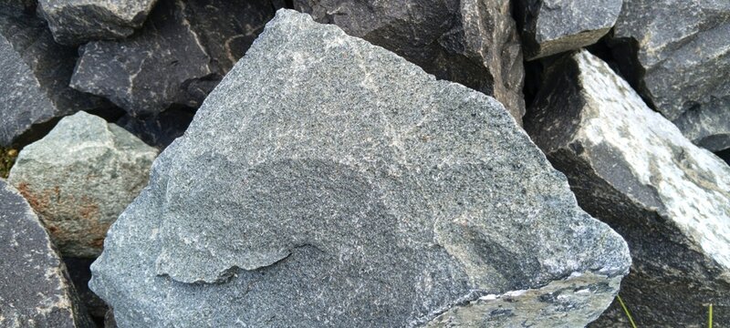 High-angle view of crushed mountain limestone aggregate, perfect for reinforcing highway subbase layers and concrete roads