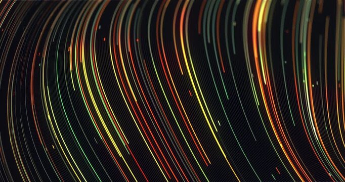 Abstract animation of warm orange, yellow and green light trails sweeping in smooth parallel curves across a black background.