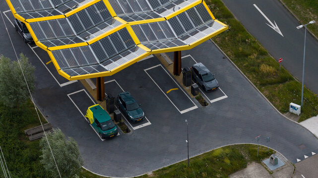 Muiden, Netherlands - 11 June 2026: Aerial drone view of a Fastned charging station, showcasing ultra fast electric vehicle charging, sustainable mobility and highway infrastructure.