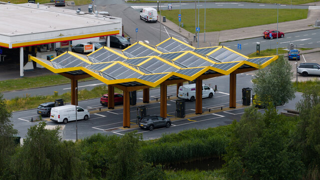 Muiden, Netherlands - 11 June 2026: Aerial drone view of a Fastned charging station, showcasing ultra fast electric vehicle charging, sustainable mobility and highway infrastructure.