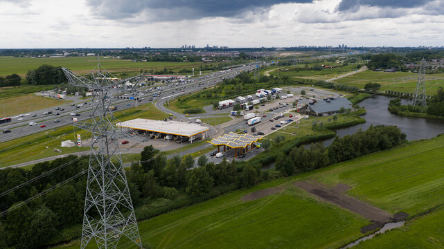 Muiden, Netherlands - 11 June 2026: Aerial drone view of a Fastned charging station, showcasing ultra fast electric vehicle charging, sustainable mobility and highway infrastructure.