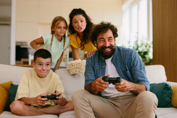 Family enjoying video game fun at home © djile