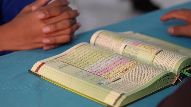 Close-Up of Quran Reading and Islamic Study Session